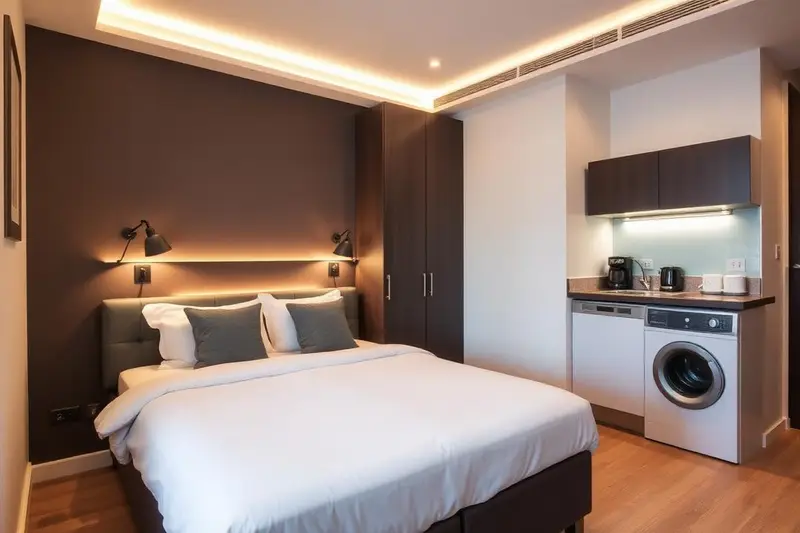 Compact modern studio apartment with bed and kitchenette in Dundee